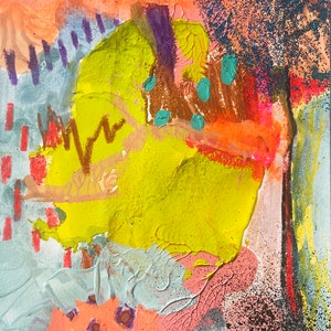 May include: Abstract painting with bright colors, including yellow, orange, pink, blue, and purple. The painting has a textured surface and includes glitter.