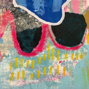 May include: An abstract painting on canvas featuring a large blue shape with a white outline, two solid black circular forms, and vibrant hot pink accents. The composition includes light blue areas with small yellow vertical dashes and textured layers.
