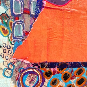 May include: Abstract art painting with a mix of colours and textures. The painting features a large orange section with a torn edge, a blue and purple section with geometric shapes, and a bottom section with blue and orange circles.
