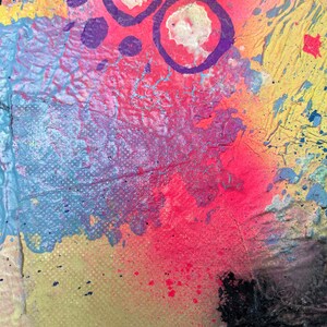 May include: Abstract painting with a colorful background of pink, blue, yellow, and orange. The painting features purple circles and dots.