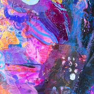 May include: Abstract painting featuring vibrant colours, including purple, pink, blue, and gold. The painting incorporates a variety of textures and shapes, creating a dynamic and energetic composition.
