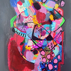 May include: Abstract painting with a colourful, layered design. The painting features a variety of shapes, lines, and textures in shades of pink, red, blue, yellow, green, and black. The background is a dark grey.