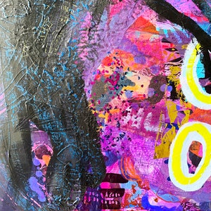 May include: Abstract painting with vibrant colours, including pink, purple, blue, yellow, and black. The painting features a large black shape on the left side of the image, and a yellow circle with a white outline on the right side of the image.
