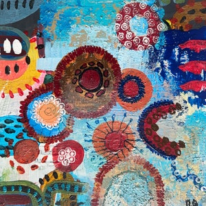 May include: Abstract painting with a blue background and colourful circles, dots, and swirls. The painting features a variety of colours, including red, yellow, blue, green, and brown.