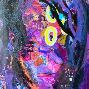 May include: Abstract painting with a purple background and black, yellow, and blue accents. The painting features a face with a large black eye and a yellow circle around it.
