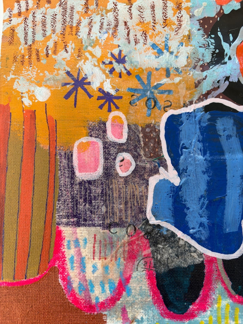 May include: An abstract painting on canvas featuring a vibrant mix of orange, deep blue, and hot pink colors. The composition includes layered textures, hand-painted star shapes in purple and blue, and visible collage elements with printed text fragments.