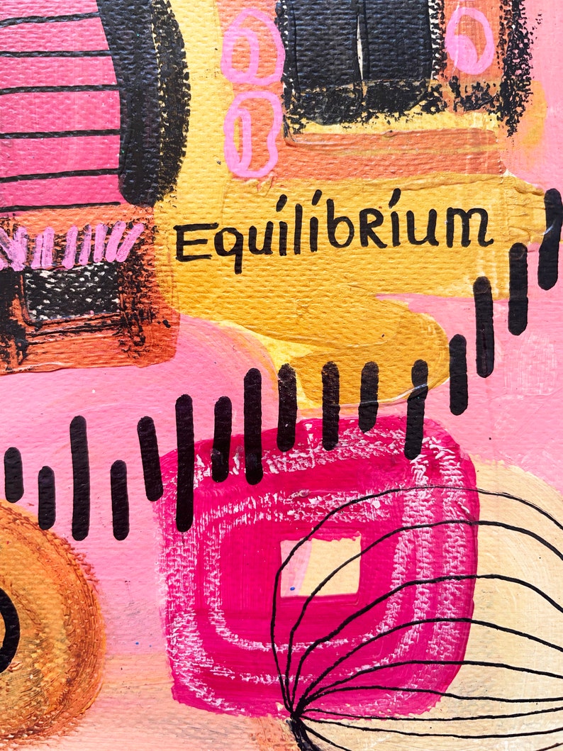 May include: Abstract painting with pink, yellow, black, and white paint. The painting features geometric shapes and lines. The word "Equilibrium" is written in black paint on a yellow background.