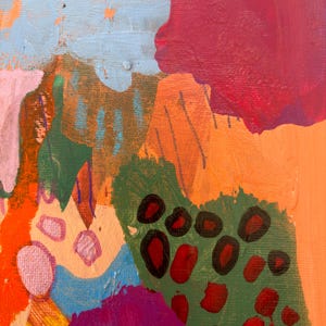 May include: An abstract painting on canvas featuring a vibrant composition of layered shapes and colors. The artwork displays bold sections of magenta, bright orange, light blue, and olive green, accented by dark red circular and oval markings.