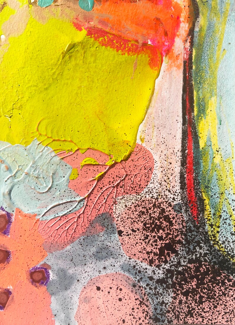 May include: Abstract painting with a yellow, orange, pink, and blue color scheme. The painting has a textured surface and a splattered effect.