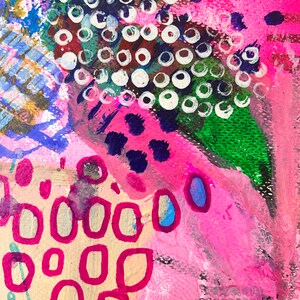 May include: Abstract painting with pink, green, blue, and white paint. The painting features a variety of shapes and patterns, including circles, dots, and lines.