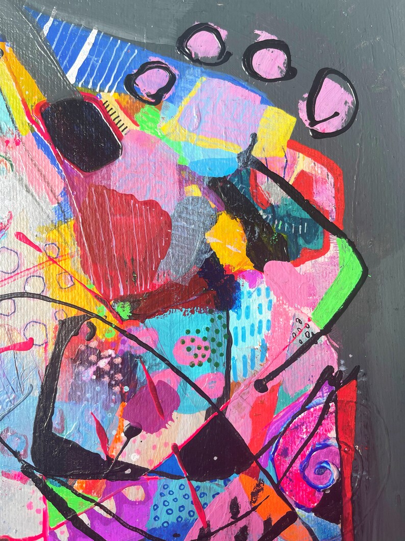 May include: Abstract painting featuring vibrant colours, including pink, blue, green, yellow, and black. The painting incorporates geometric shapes and lines, resulting in a dynamic and energetic composition.