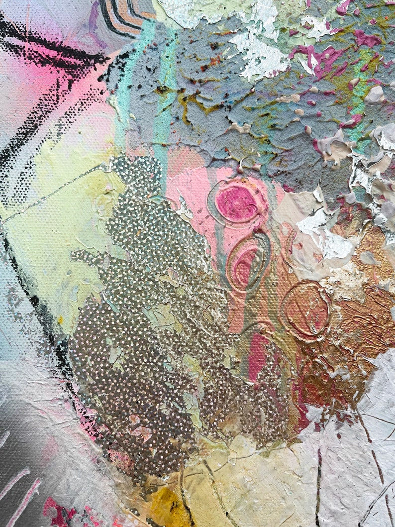 May include: Abstract painting with a textured surface. The painting features a variety of colors, including pink, gold, and white. The paint is applied in a thick, layered style, creating a sense of depth and dimension.