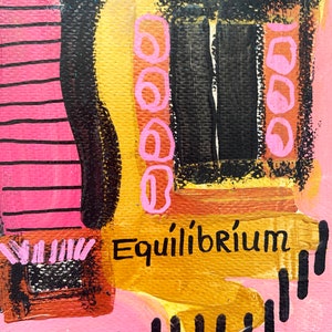 May include: Abstract painting with pink, black, yellow, and orange colors. The painting features geometric shapes and the word "Equilibrium" written in black.