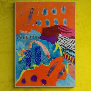 May include: Abstract painting with a collage of colorful shapes and textures. The painting features a bright orange background with blue, purple, and white shapes. The painting is framed in a wooden frame.