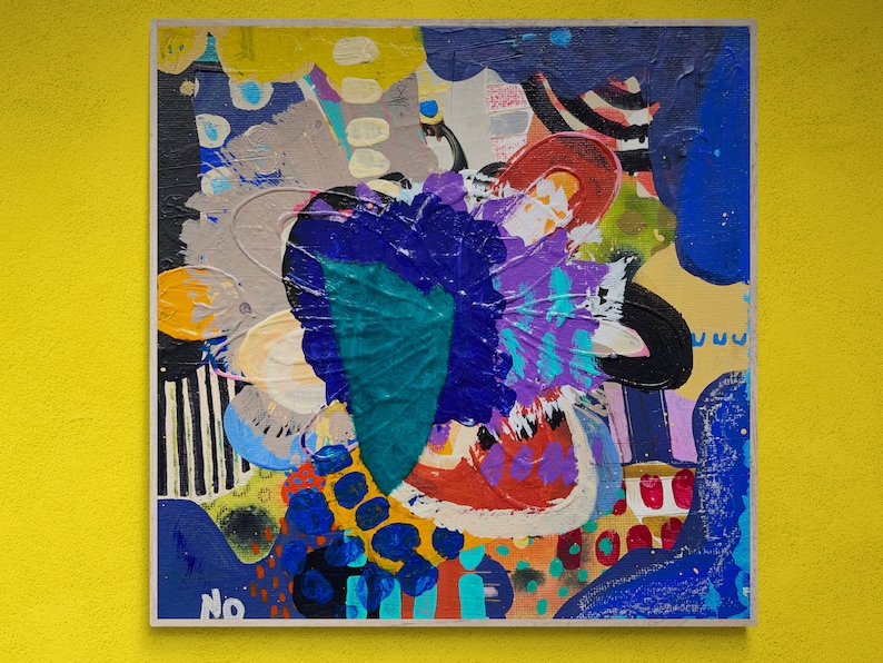 May include: Abstract painting with a colourful, layered design. The painting features a variety of shapes and colours, including blue, purple, green, yellow, and red. The painting is framed and has a white border.