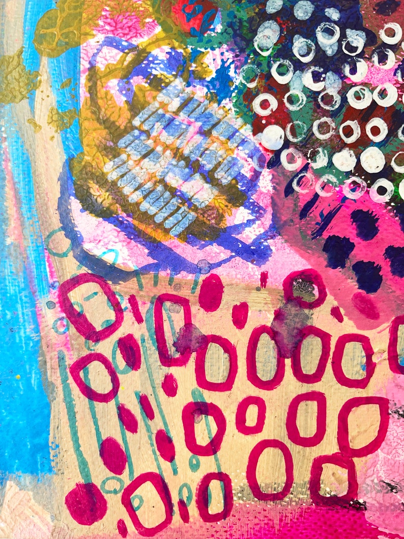 May include: Abstract painting with a mix of pink, blue, yellow, green, and white paint. The painting features a variety of shapes, including circles, squares, and rectangles. The painting has a textured surface.