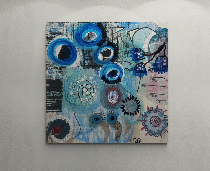 May include: Abstract painting featuring blue, black, white and red colours. The painting incorporates swirling patterns, circles and dots. The painting is on a canvas.