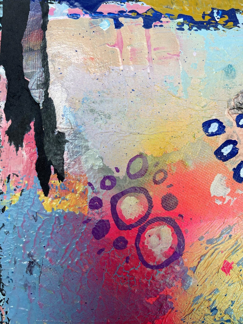 May include: Abstract painting with a colorful background of pink, blue, yellow, and red. The painting features purple circles and lines.
