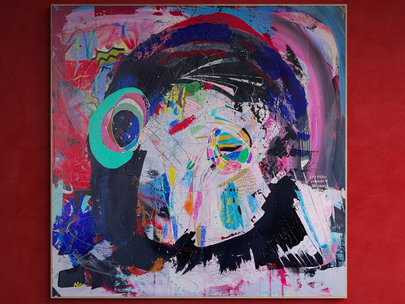 May include: Abstract painting with a black, blue, and green circular design in the upper left corner. The background is a mix of pink, red, white, and blue.