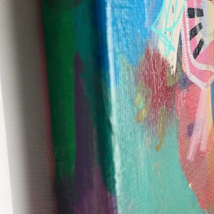 May include: Abstract painting on canvas with a yellow, blue, green, purple, red, and white colour scheme. The painting features a variety of shapes and lines, including a large blue shape with a white line through it.