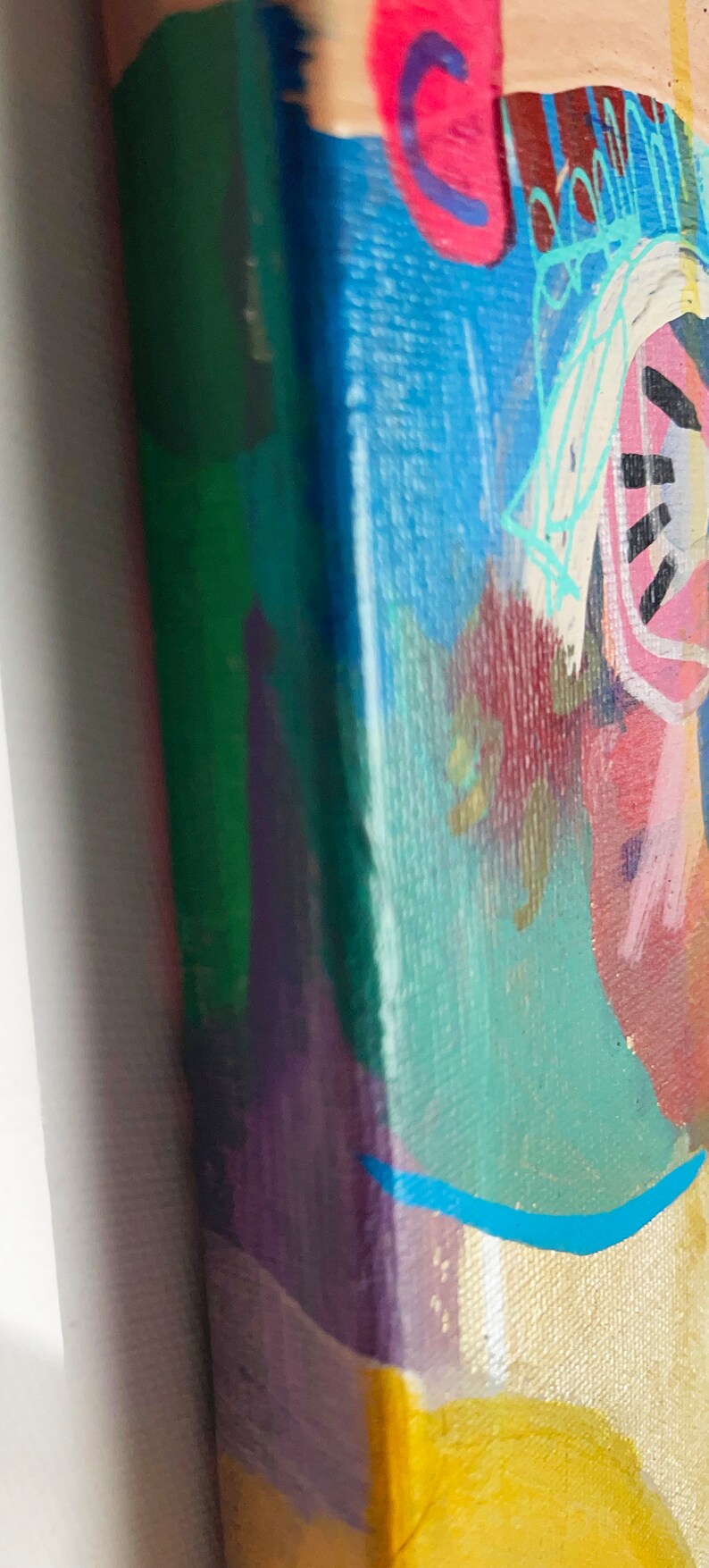 May include: Abstract painting on canvas with a yellow, blue, green, purple, red, and white colour scheme. The painting features a variety of shapes and lines, including a large blue shape with a white line through it.