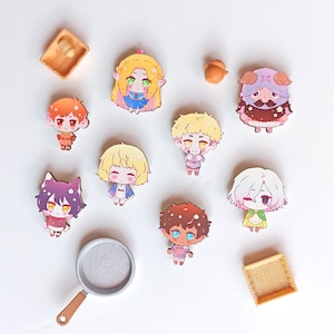 May include: A collection of eight colourful cartoon character pins featuring a variety of designs, including a girl with blonde hair, a boy with brown hair, a girl with pink hair, a boy with brown hair, a girl with blonde hair, a boy with blonde hair, a girl with brown hair, and a boy with brown hair. The pins are all on a white background.
