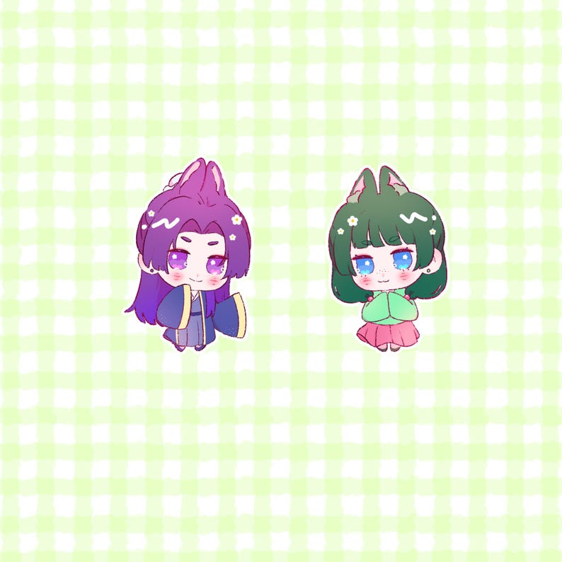 Peut inclure: Deux personnages de dessin anim&eacute; avec de grands yeux et des oreilles d'animaux. Le personnage de gauche a les cheveux violets et porte une robe bleue et violette. Le personnage de droite a les cheveux verts et porte une chemise verte et une jupe rose.