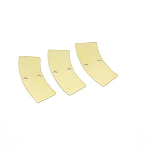 May include: Three gold-colored metal pieces shaped like curved rectangles with two holes each.