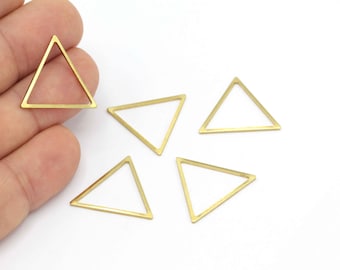 May include: Five gold-coloured metal triangle shapes. The triangles are hollow and have a smooth, shiny finish.