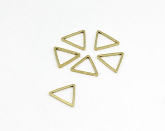 May include: Seven gold-colored triangle-shaped metal charms with a hollow center.