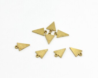 May include: Eight gold triangle charms with a small loop at the top. The charms are scattered on a white surface.