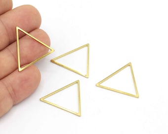 May include: Four gold-coloured triangle-shaped metal hoops. The hoops are open on one side and can be used for jewellery making or other crafts.