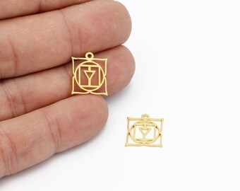 May include: Two gold-colored metal charms in the shape of a square with a symbol inside. The symbol is a circle with a triangle inside, surrounded by a square and a flower-like design.
