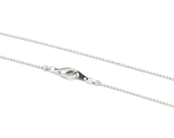 May include: A silver ball chain necklace with a lobster clasp.