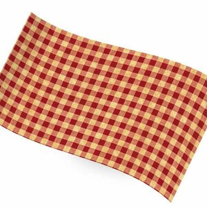May include: A red and cream-coloured checked tablecloth. The fabric features a traditional gingham pattern, with a grid of red squares alternating with cream squares. The cloth is slightly curved, as if draped over a surface.