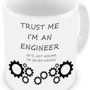 May include: White ceramic mug with the text "TRUST ME I'M AN ENGINEER" in black, and the phrase "LET'S JUST ASSUME I'M NEVER WRONG." Black gear graphics decorate the bottom. The mug has a curved handle.