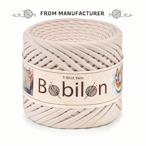 May include: A beige ball of T-Shirt yarn labelled "Bobilon" with the text "T-Shirt Yarn" on the label.