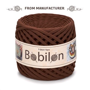May include: A large, tightly wound ball of brown T-shirt yarn. The label reads "Bobilon" with a yarn ball graphic. The text "FROM MANUFACTURER" is above the yarn. Ideal for knitting and crochet projects.