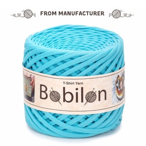 May include: A skein of turquoise blue T-shirt yarn, labelled "Bobilon T-Shirt Yarn".