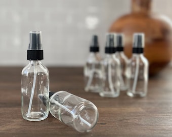 2 oz. (60 ML) Clear Boston Round Glass Bottle with Fine Mist Sprayer
