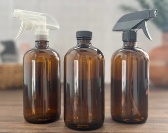 May include: Three amber glass spray bottles with black and clear spray tops. The bottles are empty and ready to be filled with your favorite cleaning solutions.