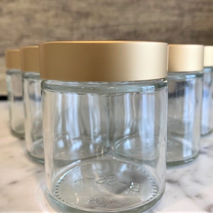 4oz Clear Glass Jar with Brushed Gold lid for Creams, skincare and essential oils.  Our Gold Lid adds a touch of elegance to any product!