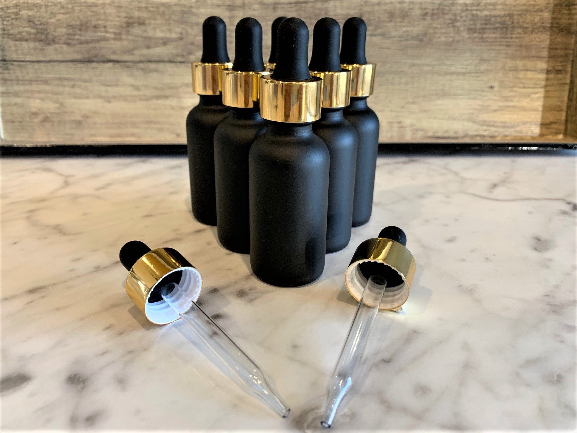 1/2 Oz. Clear Boston Round Glass Bottle, 18mm 18-400 Black Child Resistant Calibrated Dropper S 30wgf0 30wdg1 1 1/2 Oz. Clear Boston Round Glass Bottle, 18mm 18-400 Black Child Resistant Calibrated Dropper S 30wgf0 30wdg1 1