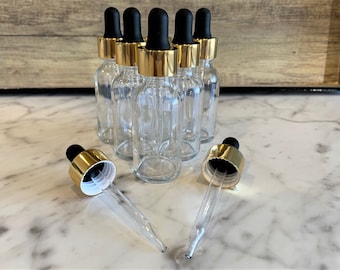 2 oz. (60 ML) Clear Boston Round Glass Bottle with Gold Glass Dropper | Black Top | Great for serums | Essential Oils | Face Oils