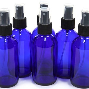 May include: Set of six cobalt blue glass spray bottles with black misters and caps. The bottles are 4 ounces each.