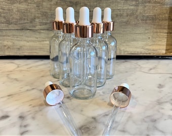 2 oz. (60 ML) Clear Boston Round Glass Bottle with Rose Gold Glass Dropper | White Top | Great for serums | Essential Oils | Face Oils