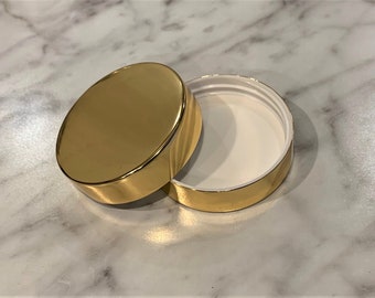 Beautiful Gold Lid | Smooth, Metal shelled, Continuous thread cap with a 89-400 neck finish and foam liner. This will enhance your products!