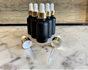 1 ons. (30 ML) Zwarte matte Boston ronde glazen fles met gouden glazen druppelaar | Witte top | Ideaal voor serums | Essentiële oliën | Gezichtsoliën