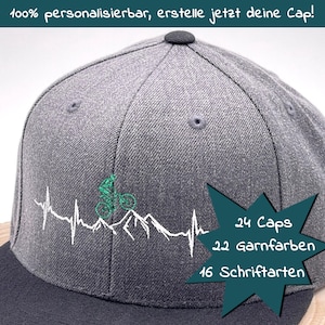Könnte beinhalten: Eine graue Baseballkappe mit einem Mountainbike-Design und einer Herzschlaggrafik. Die Kappe hat einen schwarzen Schirm und einen türkisfarbenen Sternenausbruch mit dem Text "24 Caps", "22 Garnfarben" und "16 Schriftarten".