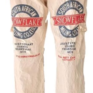 May include: Cream-coloured trousers with a drawstring waist, displaying various printed logos and text in red and blue. The text includes "Cake Flour 4.5 kg NETT" and "South African Snowflake Milling Co. Ltd."